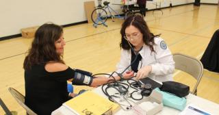 woman getting blood pressure checked