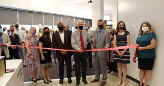faculty and staff of The Ohio State University at Marion and Marion Technical College cutting ribbon to reopen renovated student center