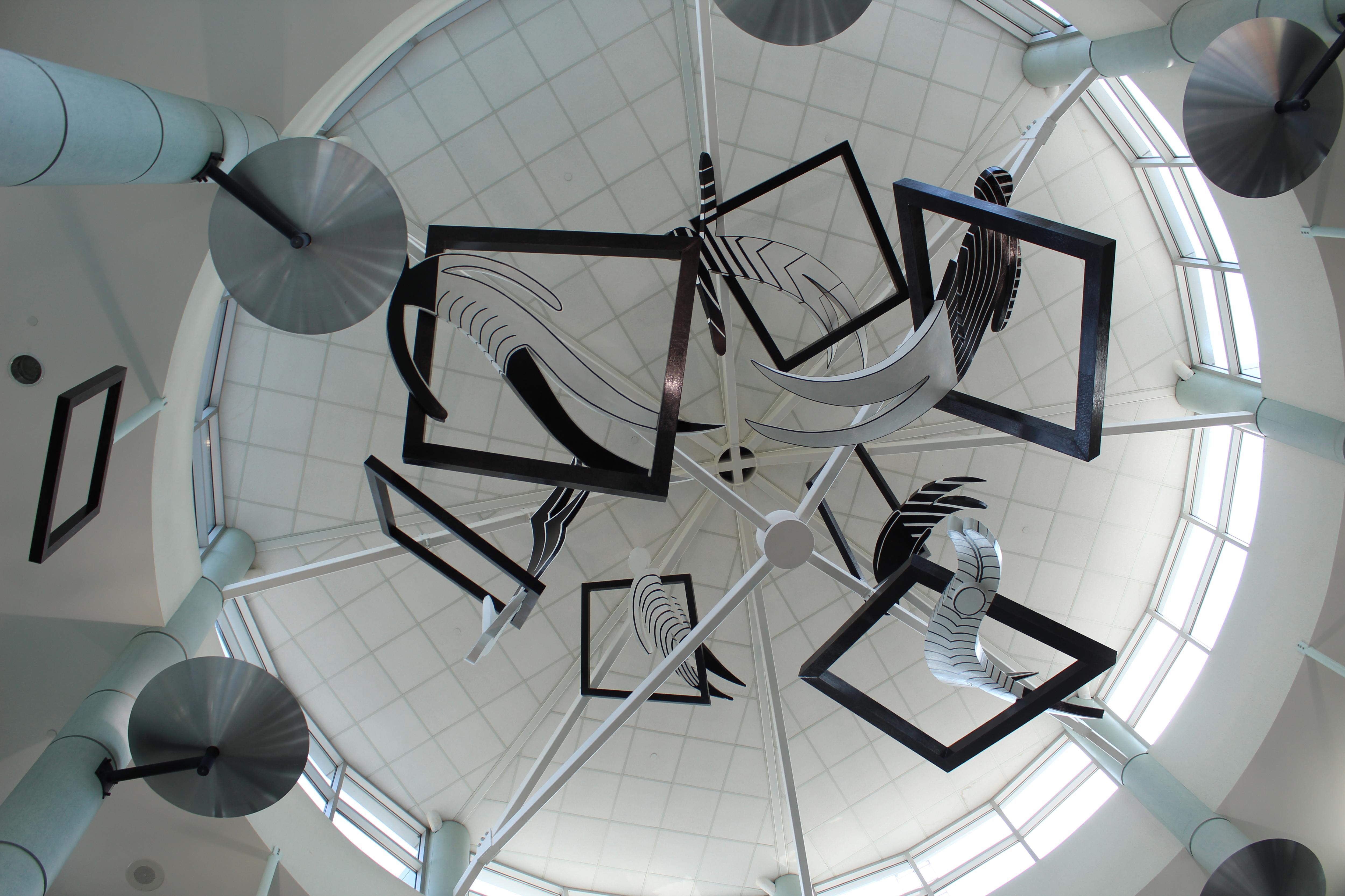 art work hanging from a rotunda ceiling