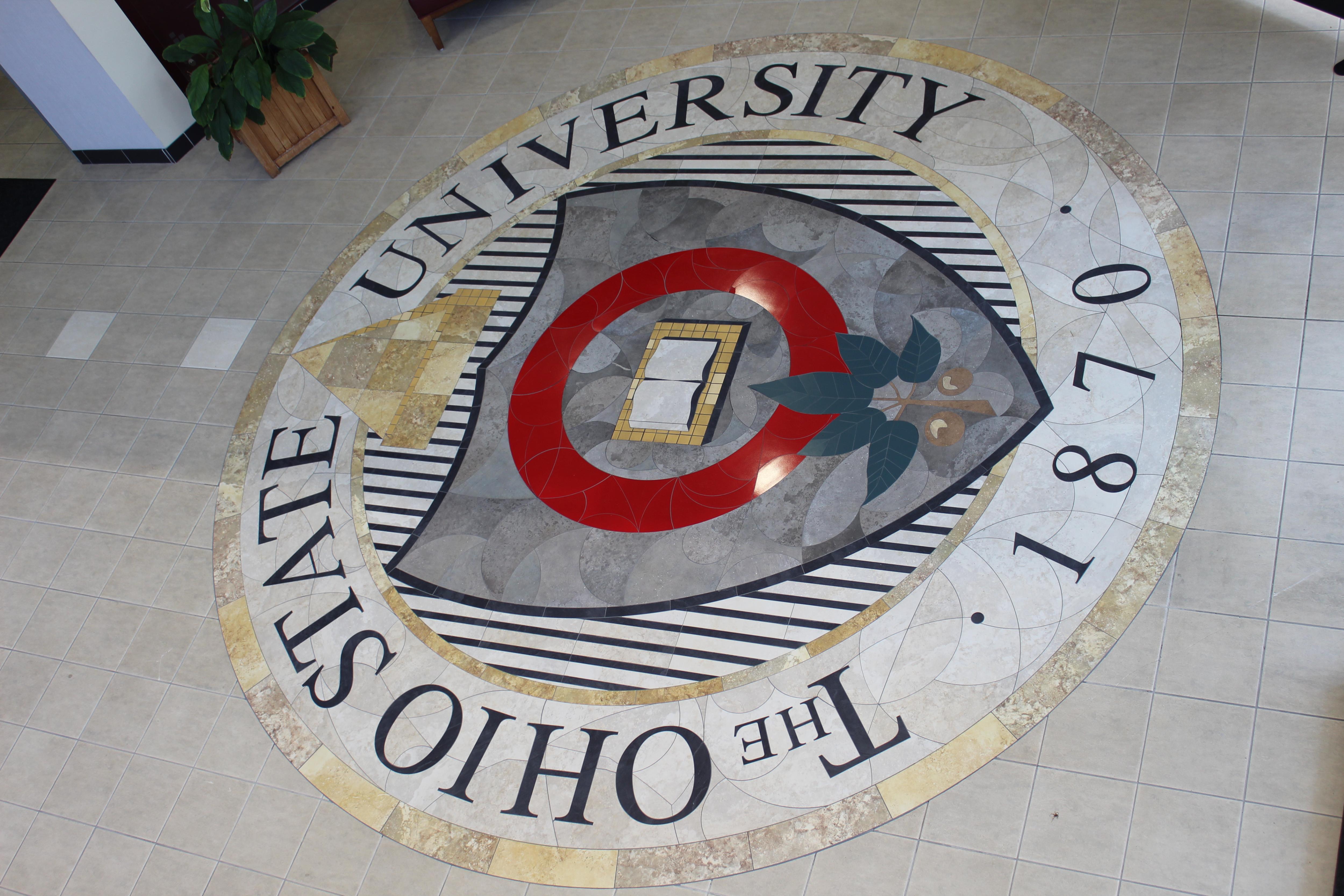 tiled seal of The Ohio State University on floor of building
