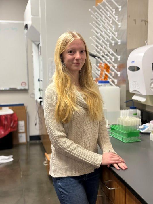 young blonde woman in science lab