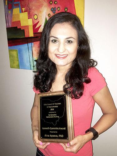 photo of Ohio State Marion Assistant Professor of Education, Aina Appova with he award