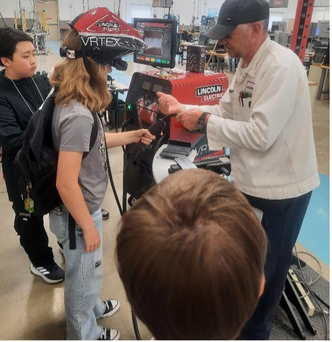 student working with machinery