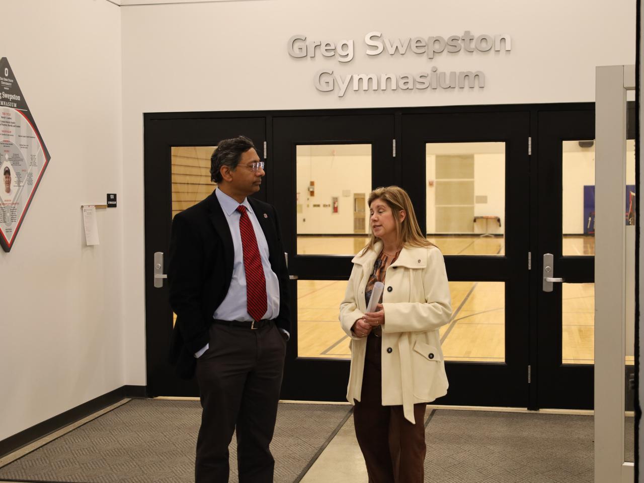 Ohio State Provost tours campus buildings with small group of people