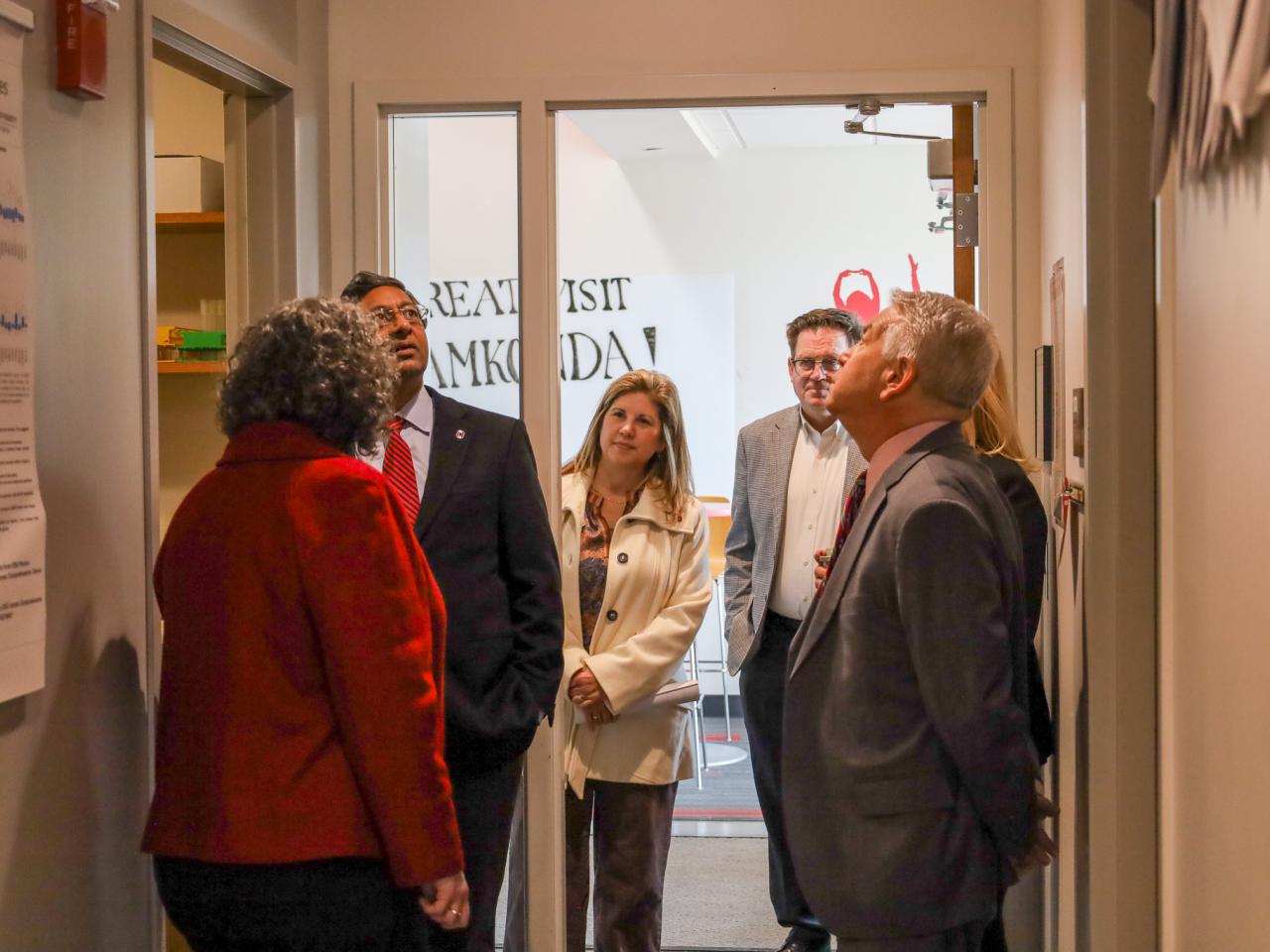 Ohio State Provost tours campus buildings with small group of people