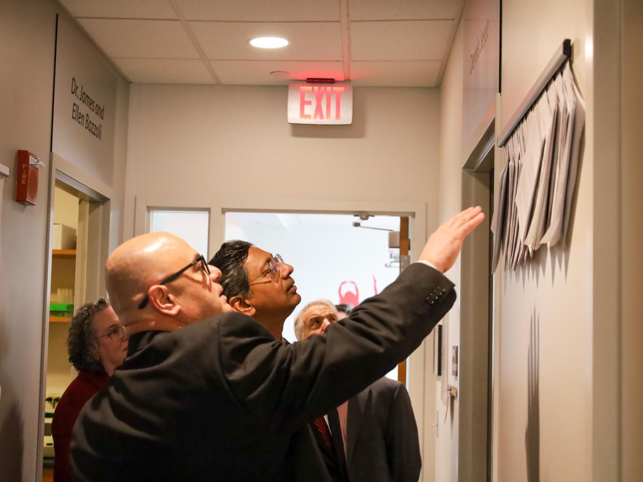 Ohio State Provost tours campus buildings with small group of people