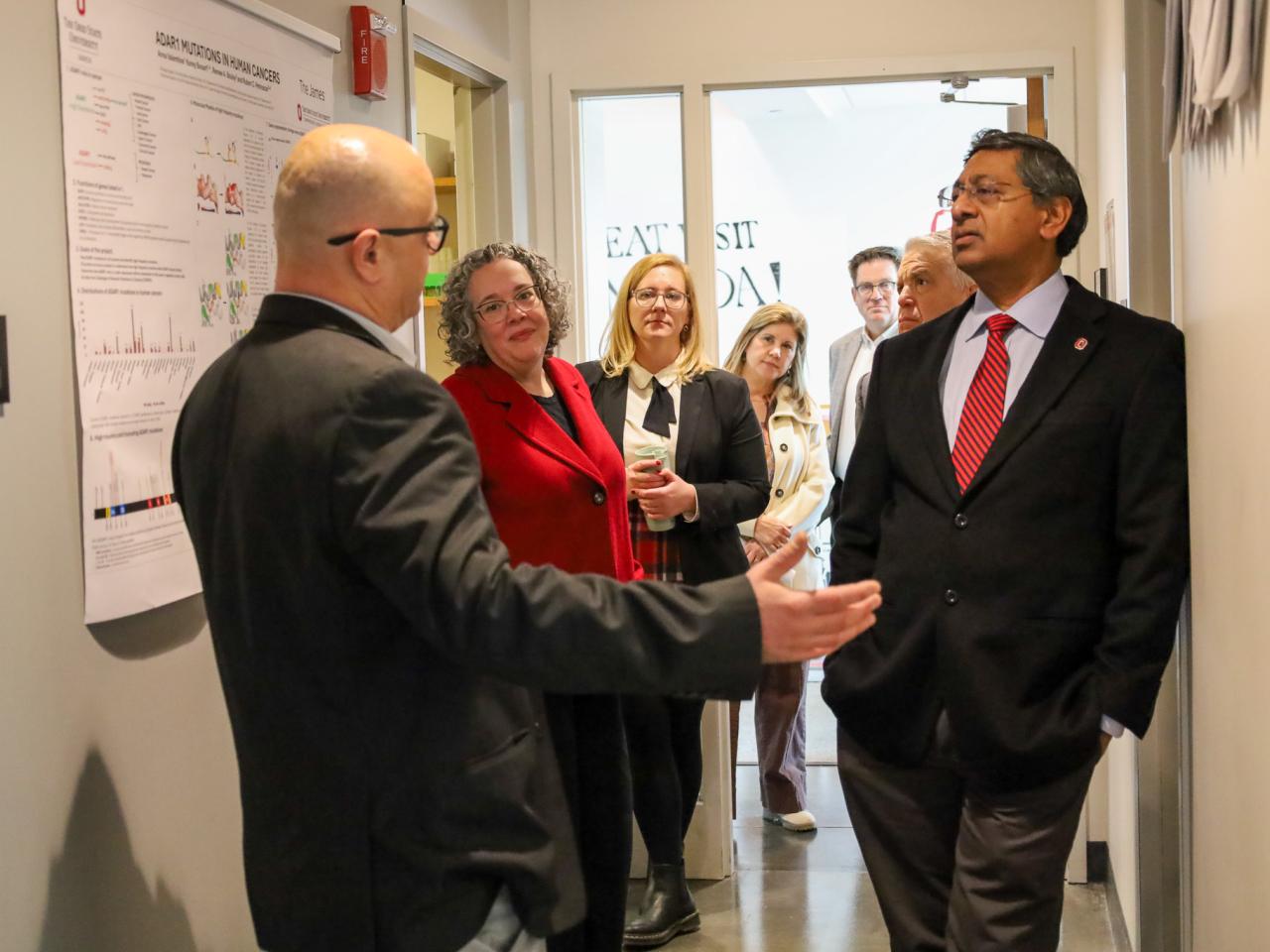 Ohio State Provost tours campus buildings with small group of people