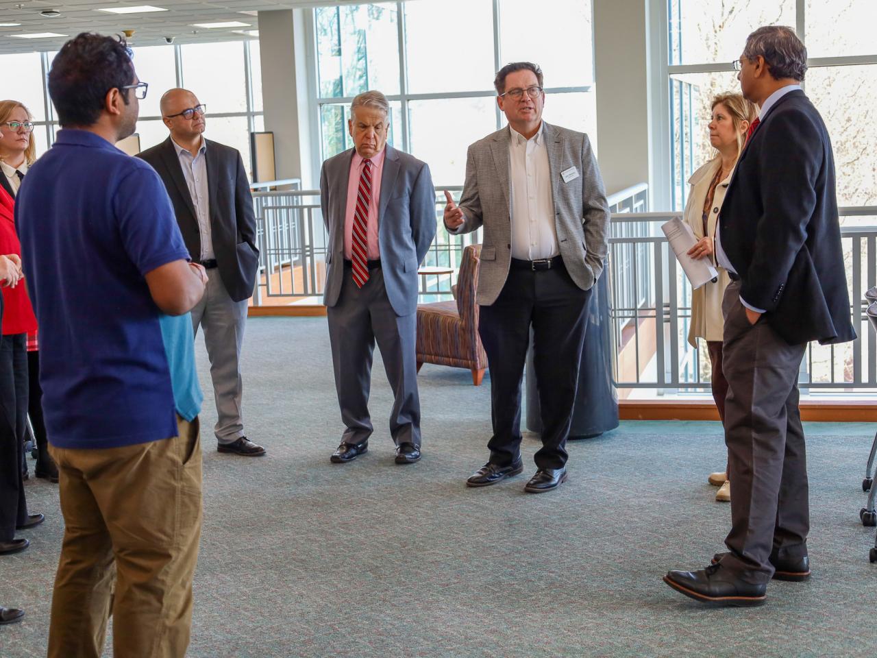 Ohio State Provost tours campus buildings with small group of people