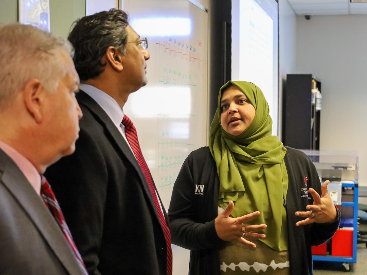 Ohio State Provost tours campus buildings with small group of people