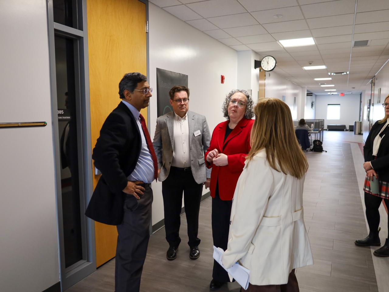 Ohio State Provost tours campus buildings with small group of people