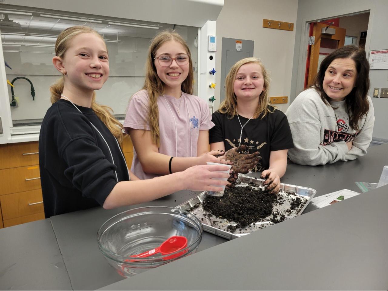 students working on seed bombs