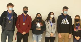 six students from area schools posing with awards