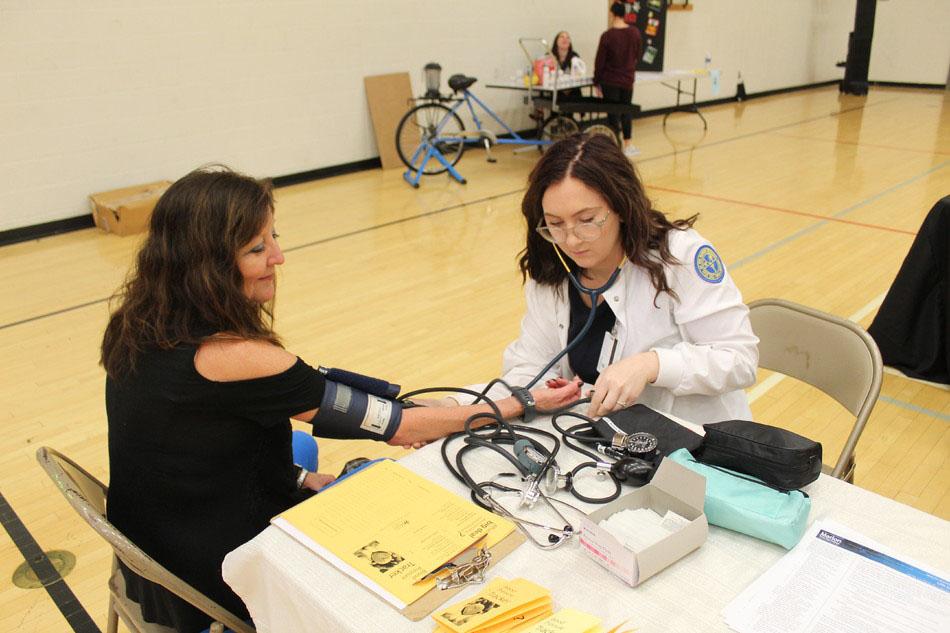 woman getting blood pressure checked