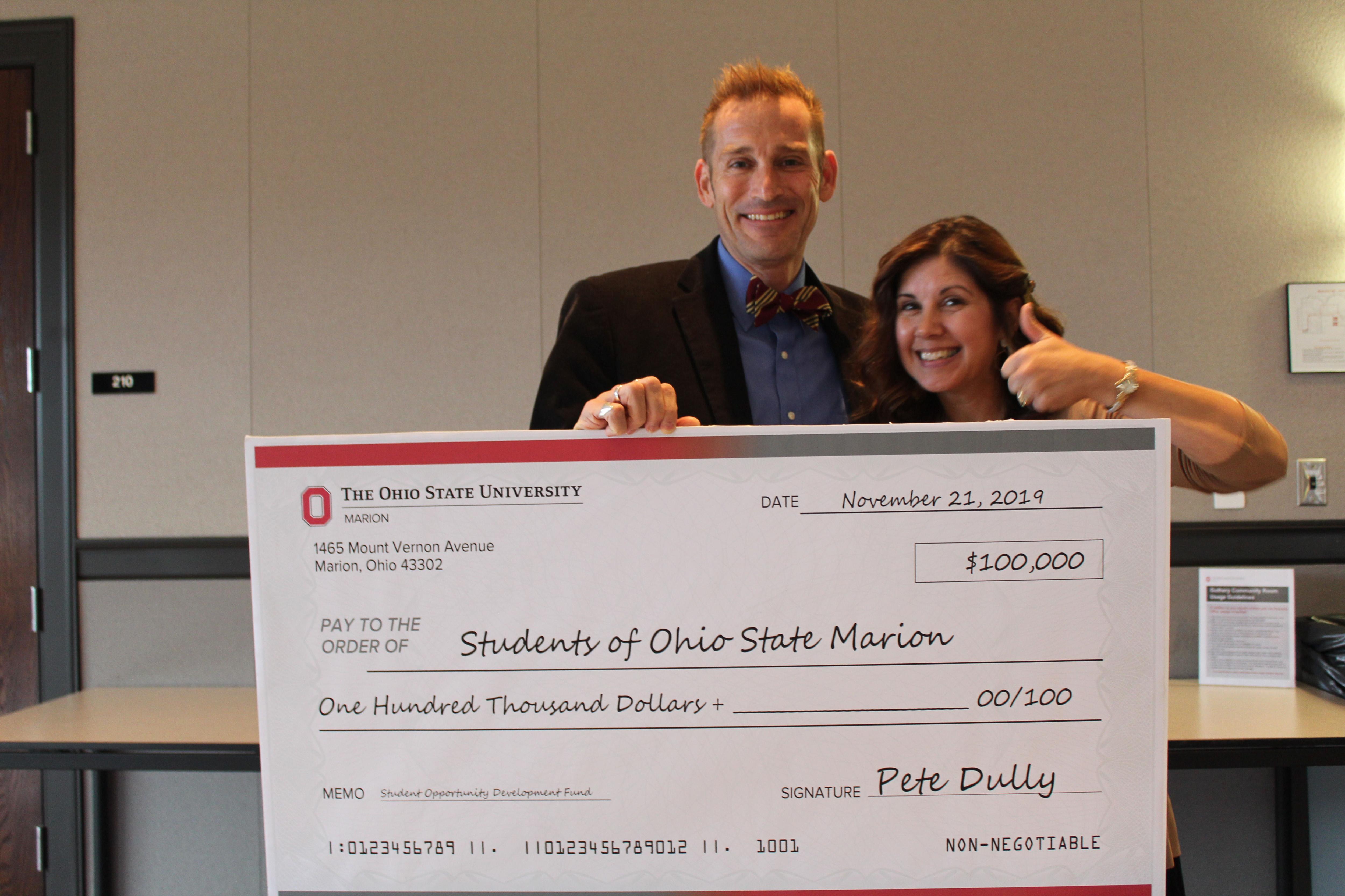 Pete Dully and Cathy Gerber with $100,000 check from Pete Dully to Students of Ohio State Marion