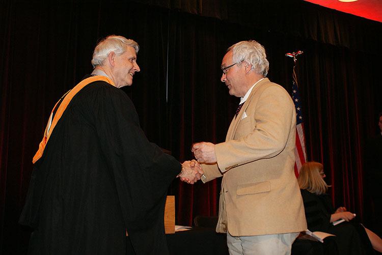 Ohio State Marion Biology Lecturer, Dr. Dan Wojta shaking hands with Gregory S. Rose, PhD, dean and director of The Ohio State University at Marion