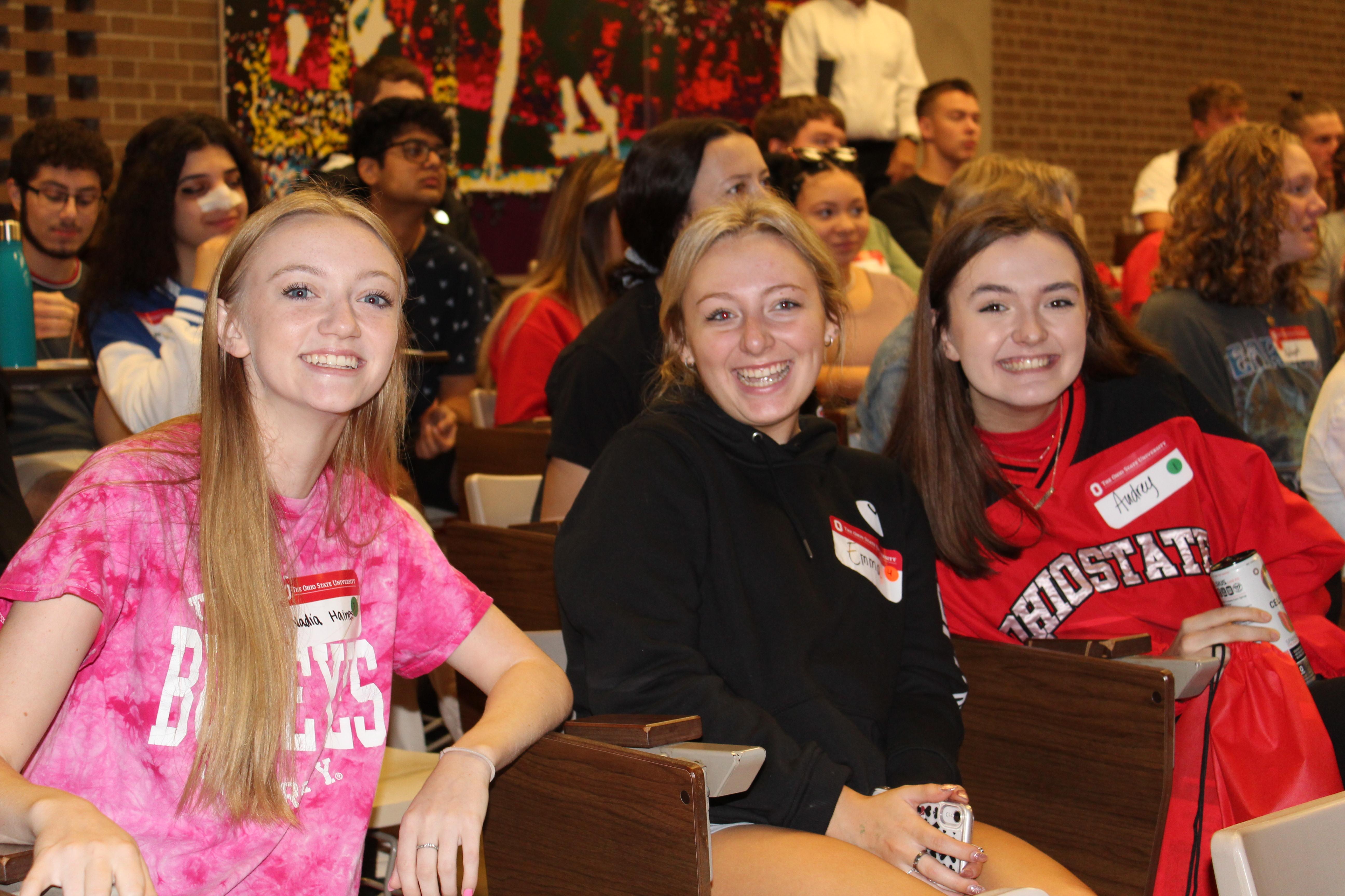 Three college women smiling for the camera