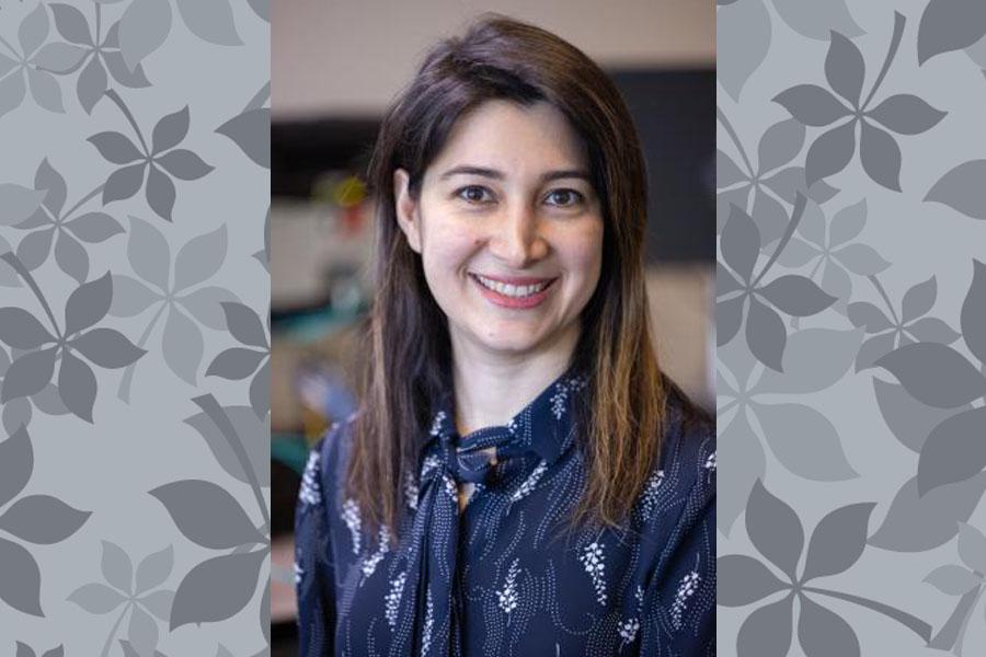 women in blue blouse with leaf background
