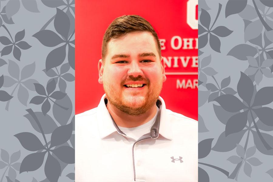 head and shoulders man with beard and mustached, red background