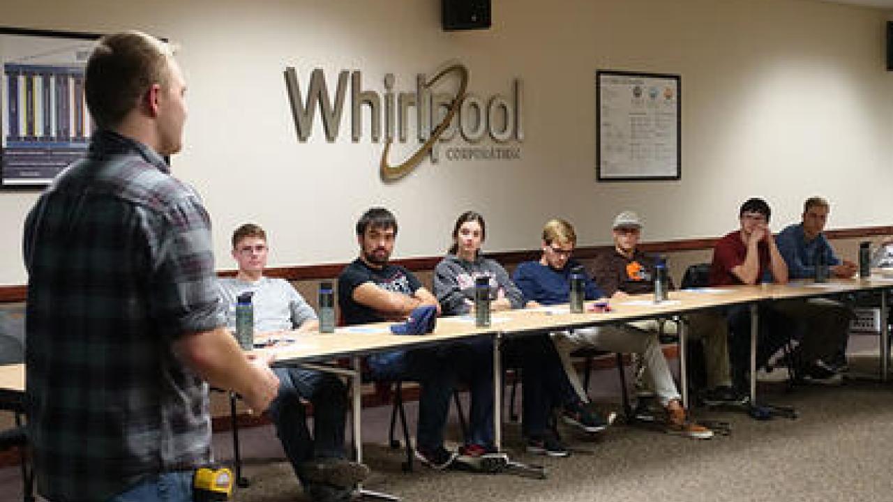 students listen to a speaker from whirlpool corp