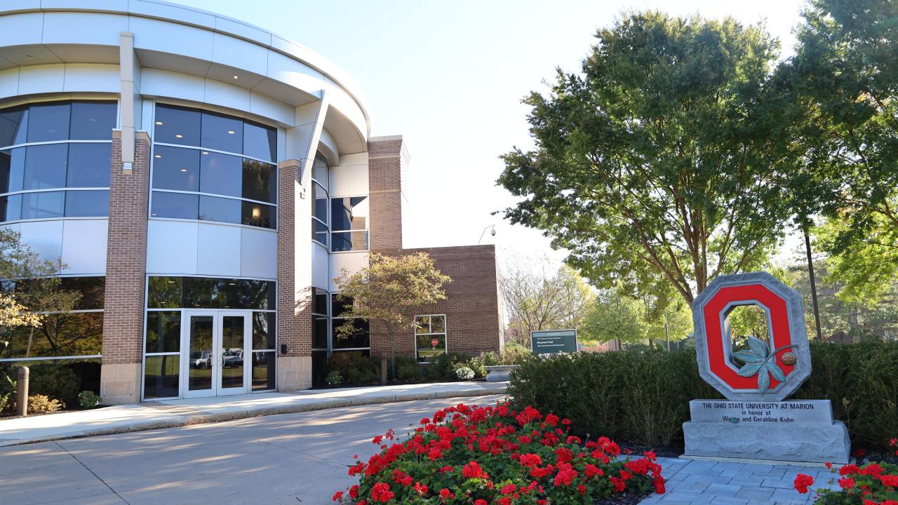 academic building with block O statue in front