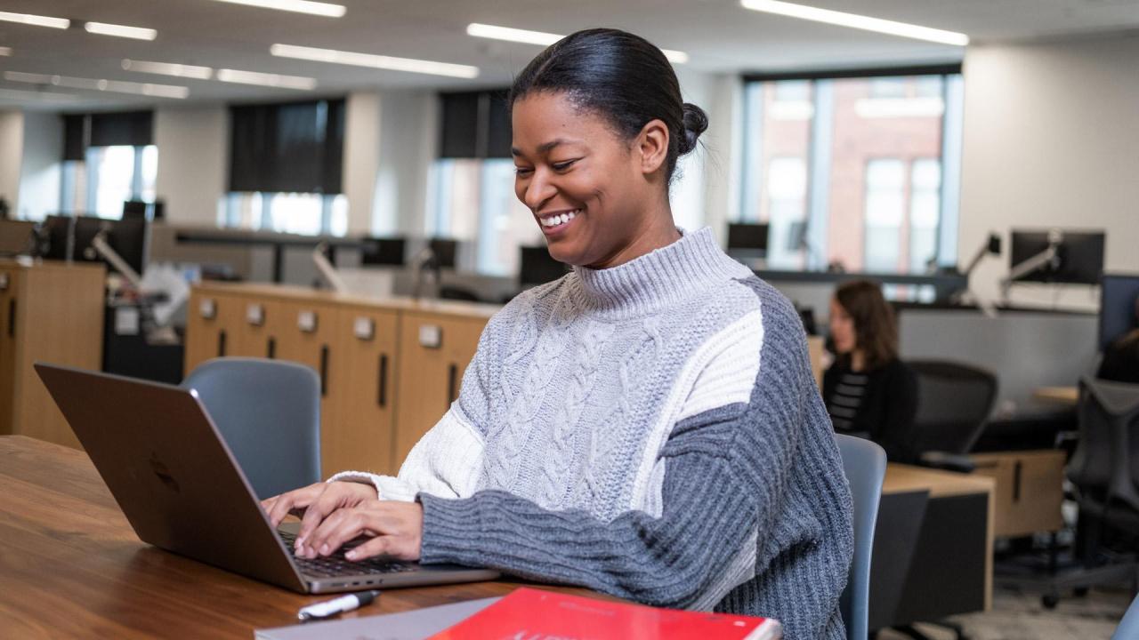 a student on a laptop in a library